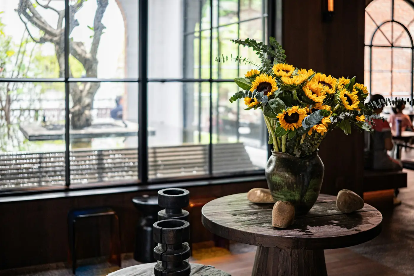 Sunflowers in a vase in a sunlit room